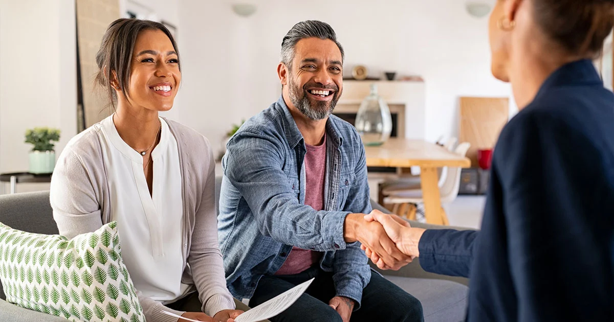 Couple making deal with banker