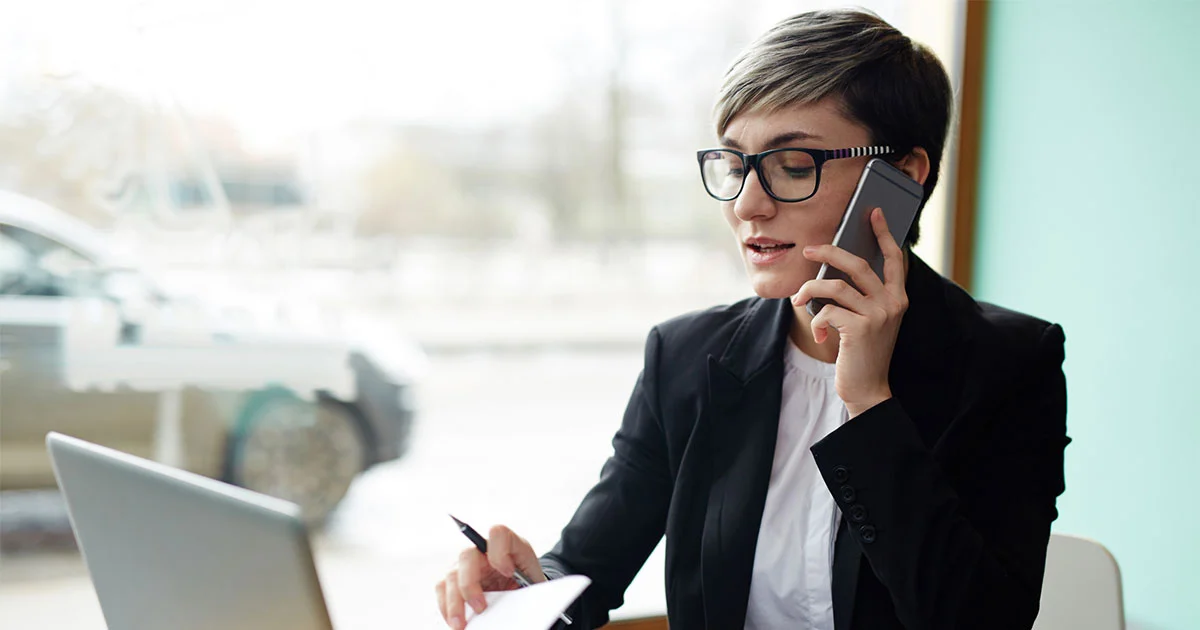 Woman making business call